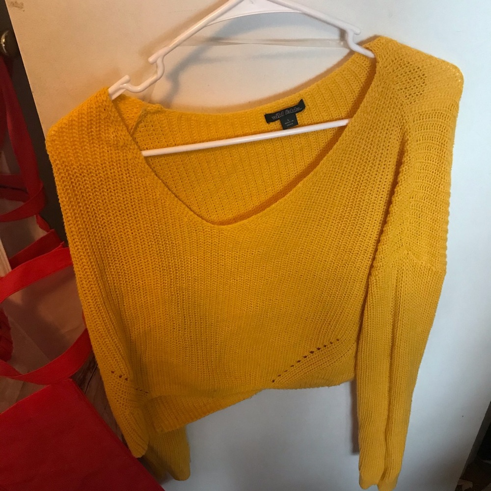 A yellow v neck lightweights sweater